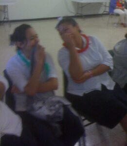 Two students enjoying Joe Libby's school performance in Alice, Texas