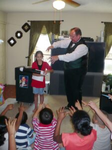 Joe Libby performing for kids at a birthday party